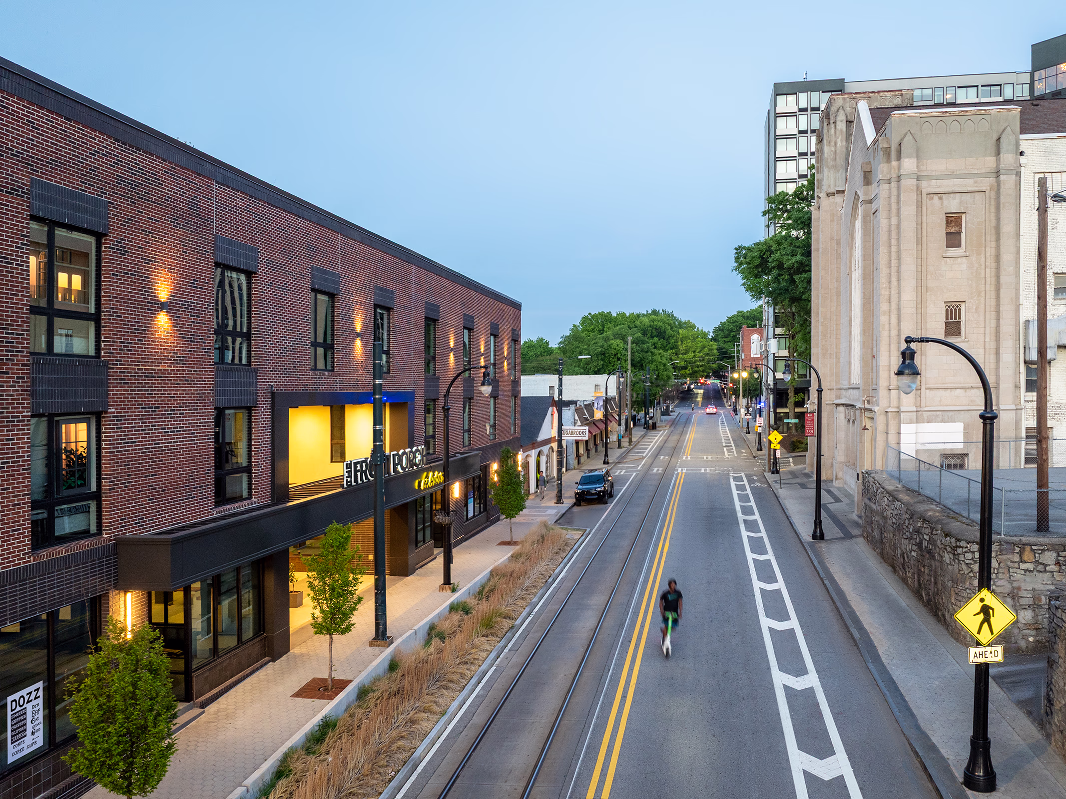Front Porch building exterior with retail signage on Auburn Avenue, Atlanta MLK Historic District at dusk