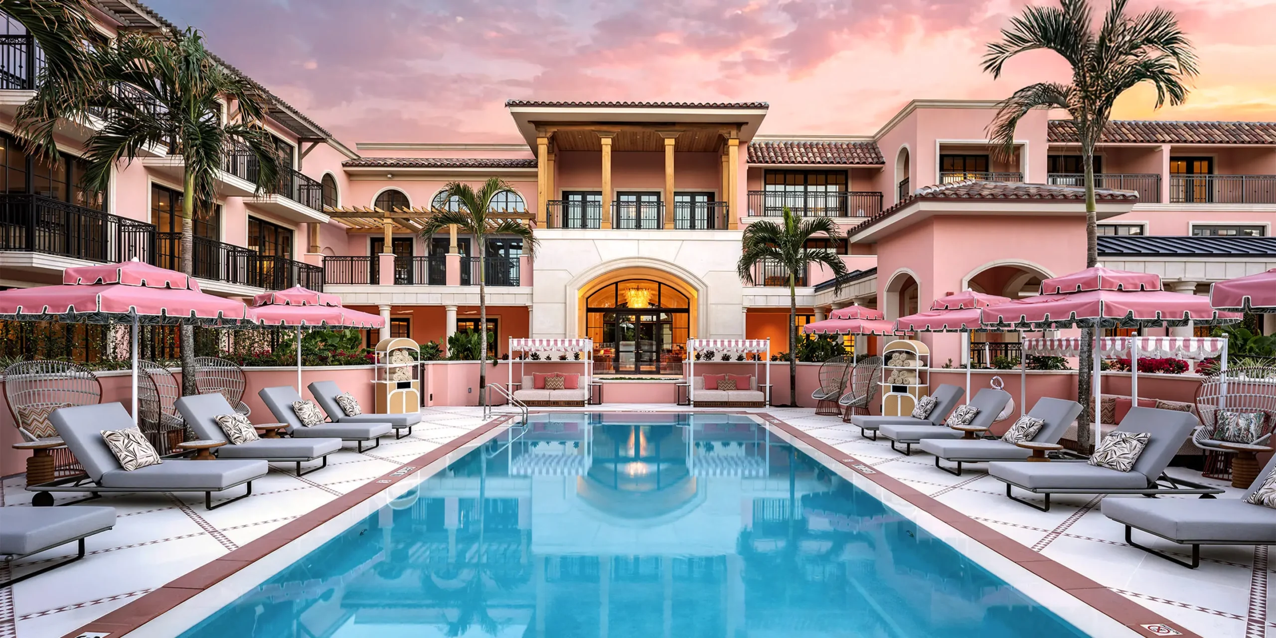 Exterior of the renovated Palm House Hotel in Palm Beach, FL with Mediterranean architectural elements