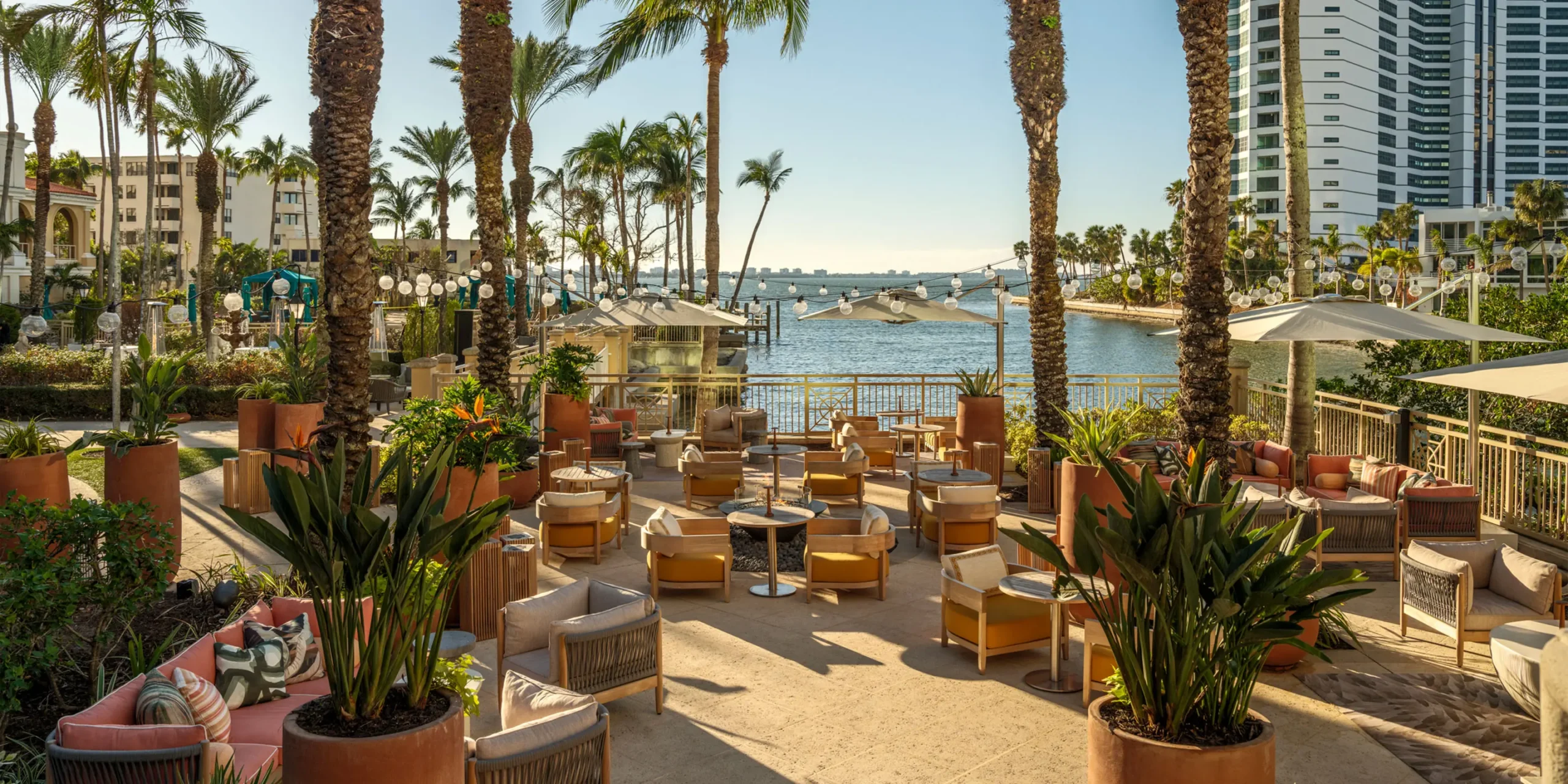 Elevated outdoor bar seating with Gulf Coast views at Rufa