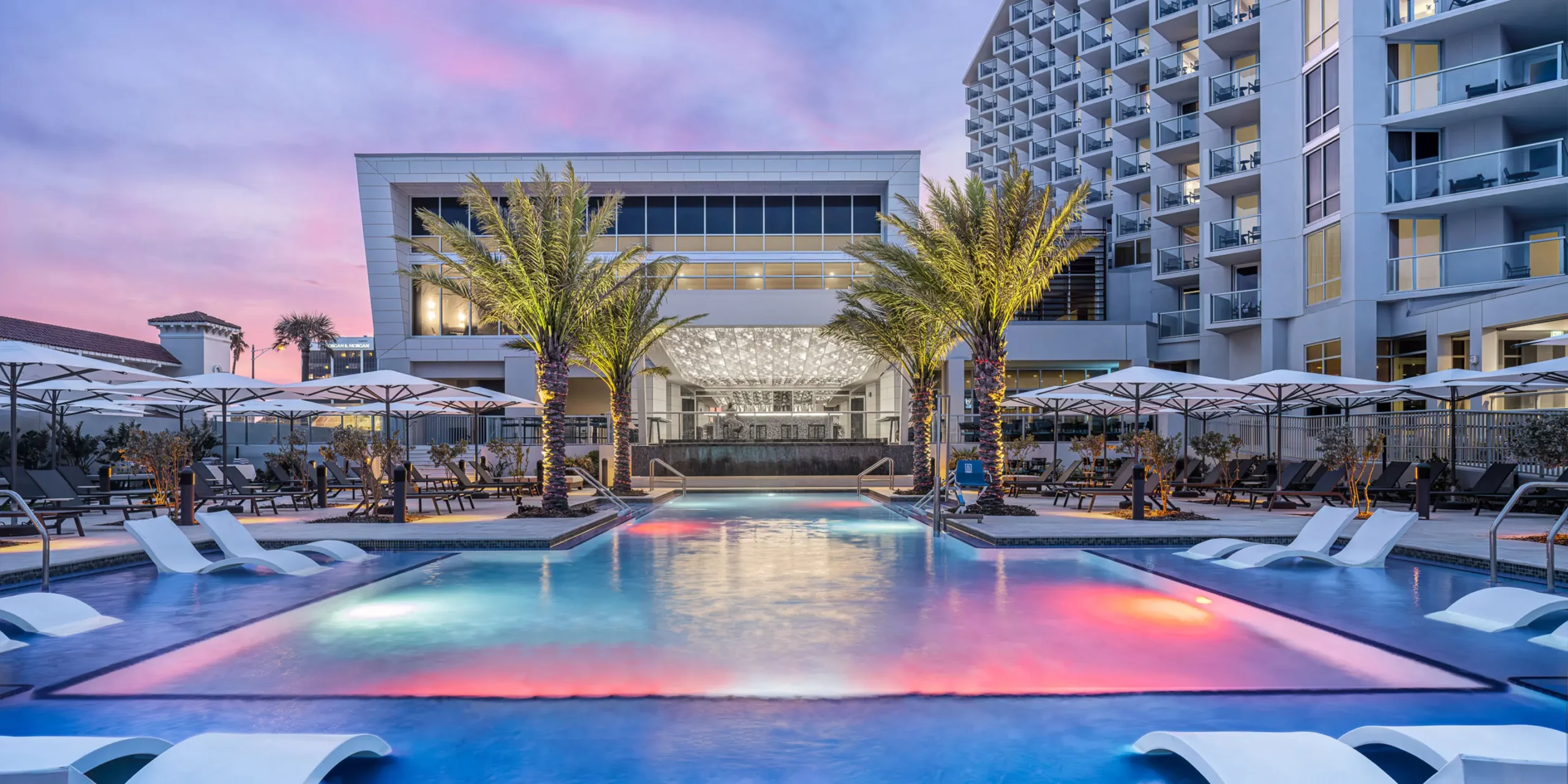 Colorfully lit-pool at Renaissance Daytona Beach Oceanfront Hotel, renovated by Cooper Carry.