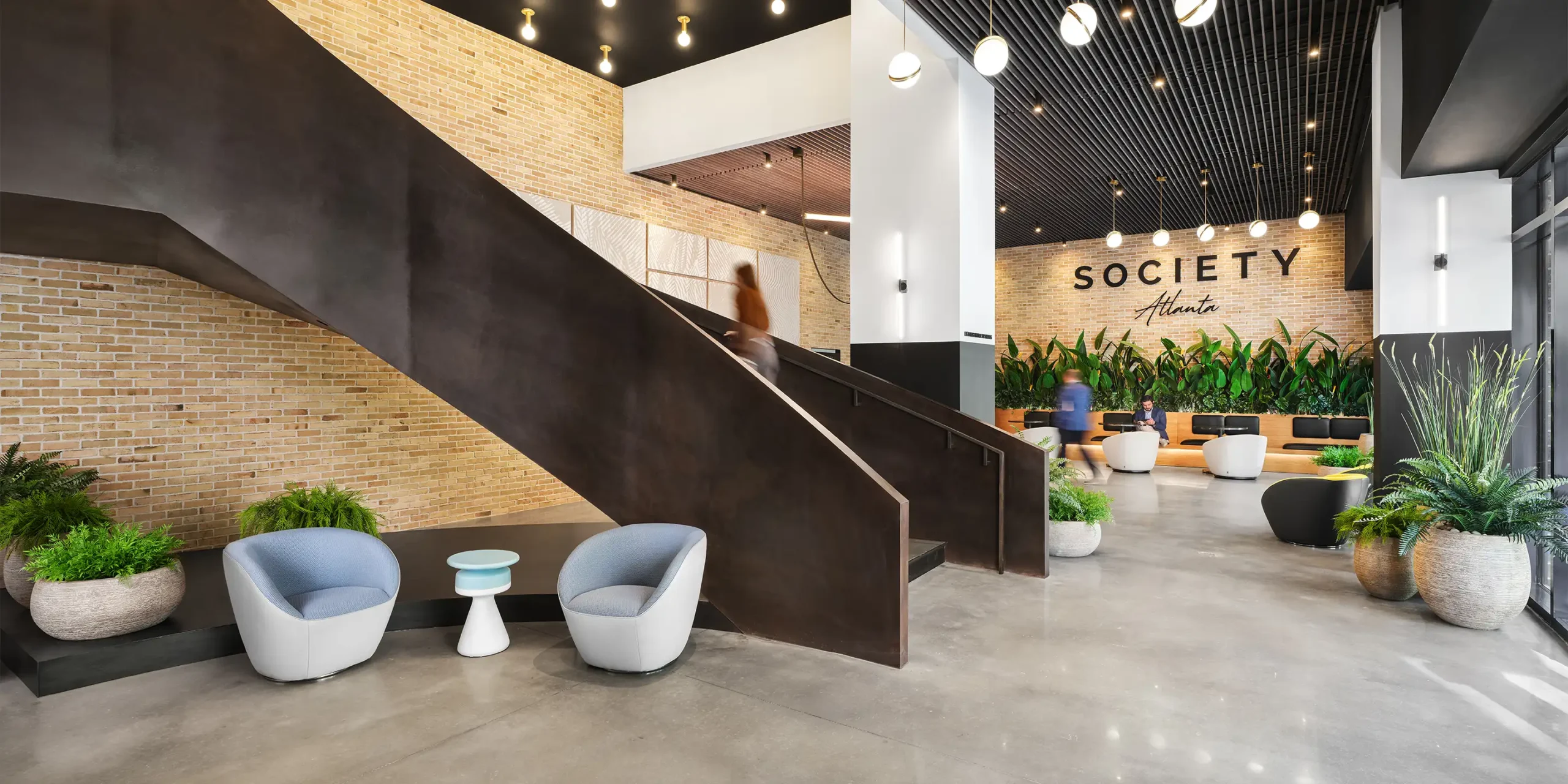 Society Atlanta lobby with sculptural black metal staircase