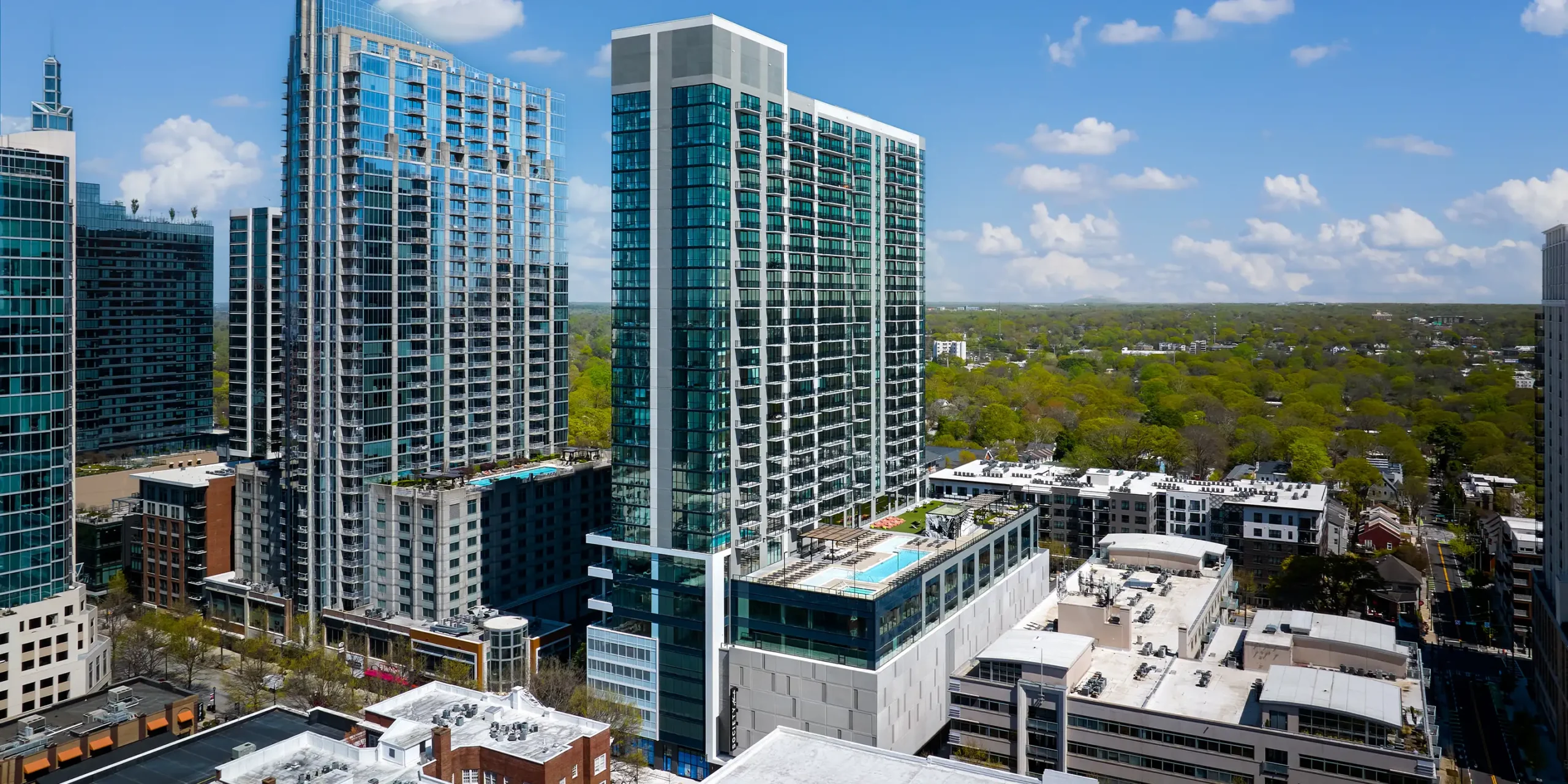 Bird’s-eye view of Society Atlanta showing amenity and parking decks among Midtown buildings
