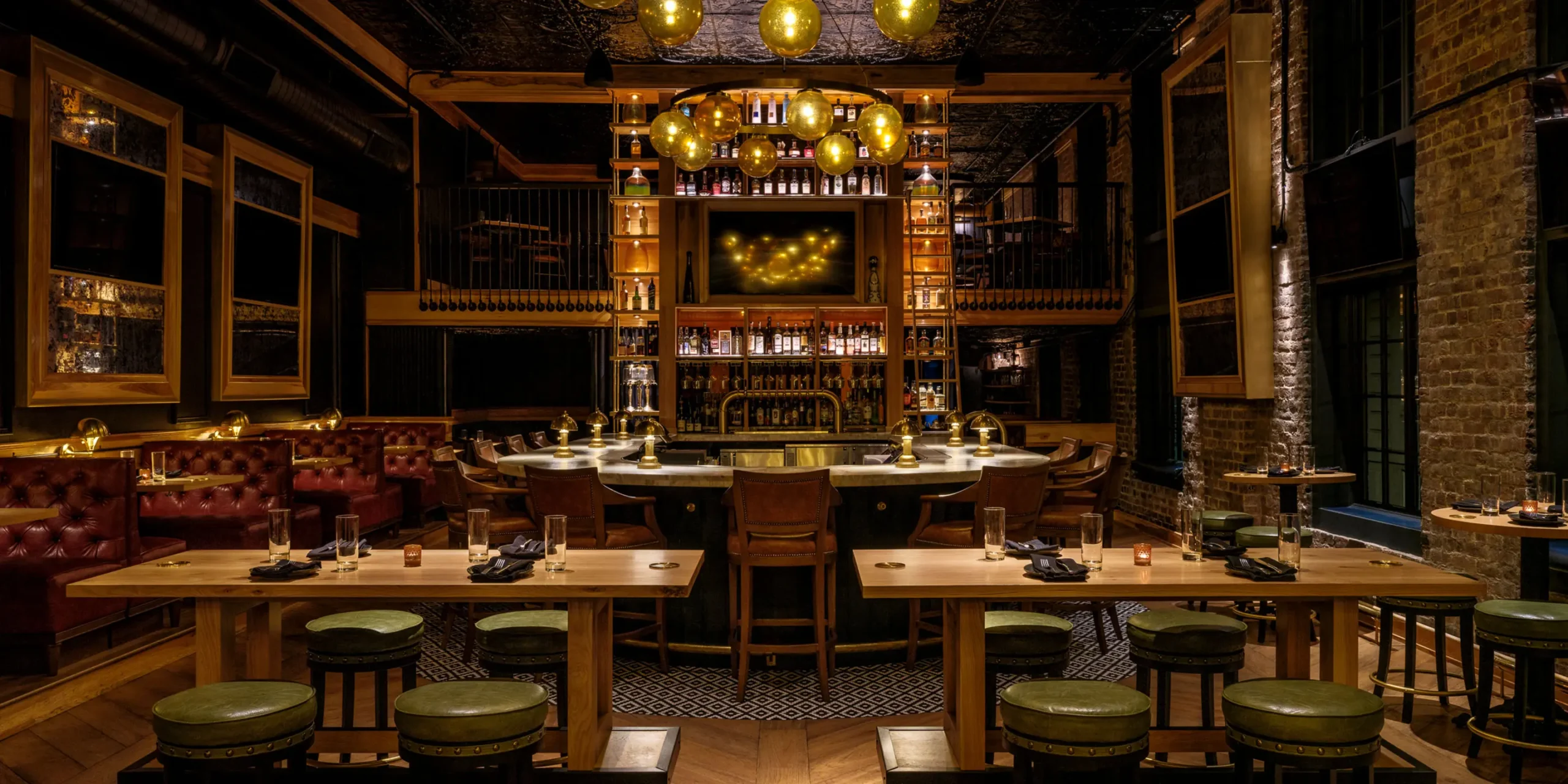 Double-height back bar with apothecary jars and liquor bottles at The Kennedy gastropub in Knoxville