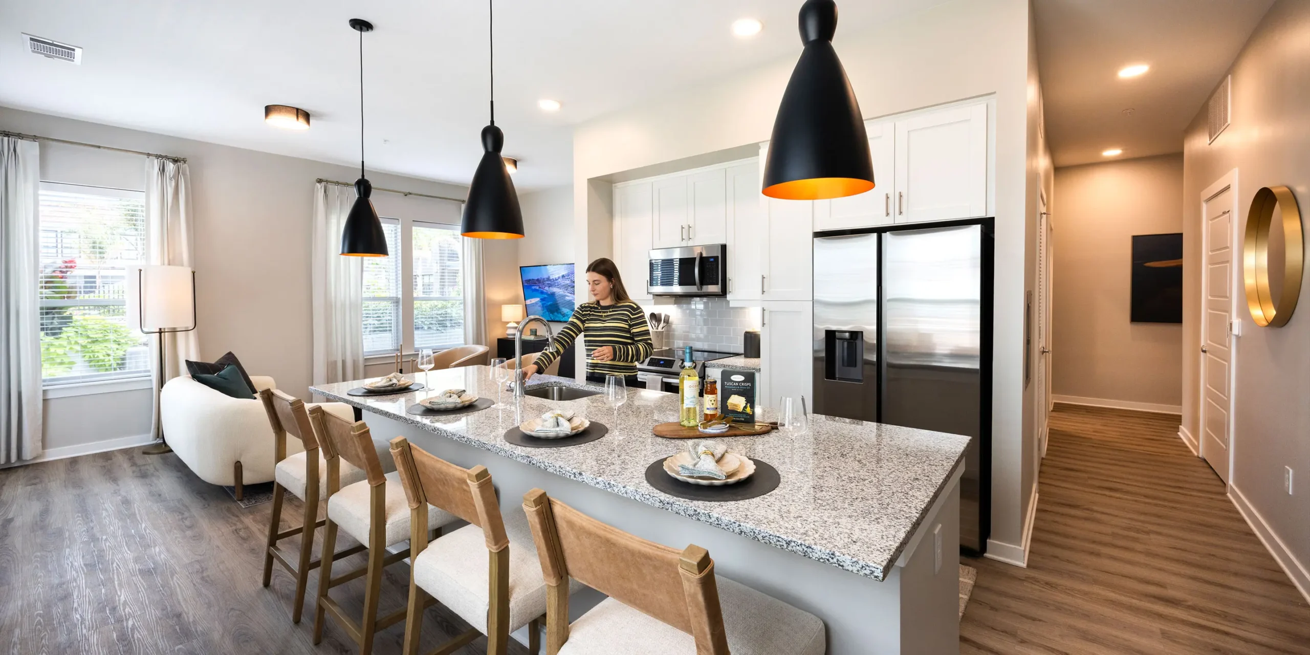 Modern apartment kitchen with custom cabinetry, island, and premium finishes at Pilot & Park.