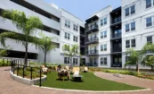Landscaped courtyard at Pilot & Park with seating and community amenities.