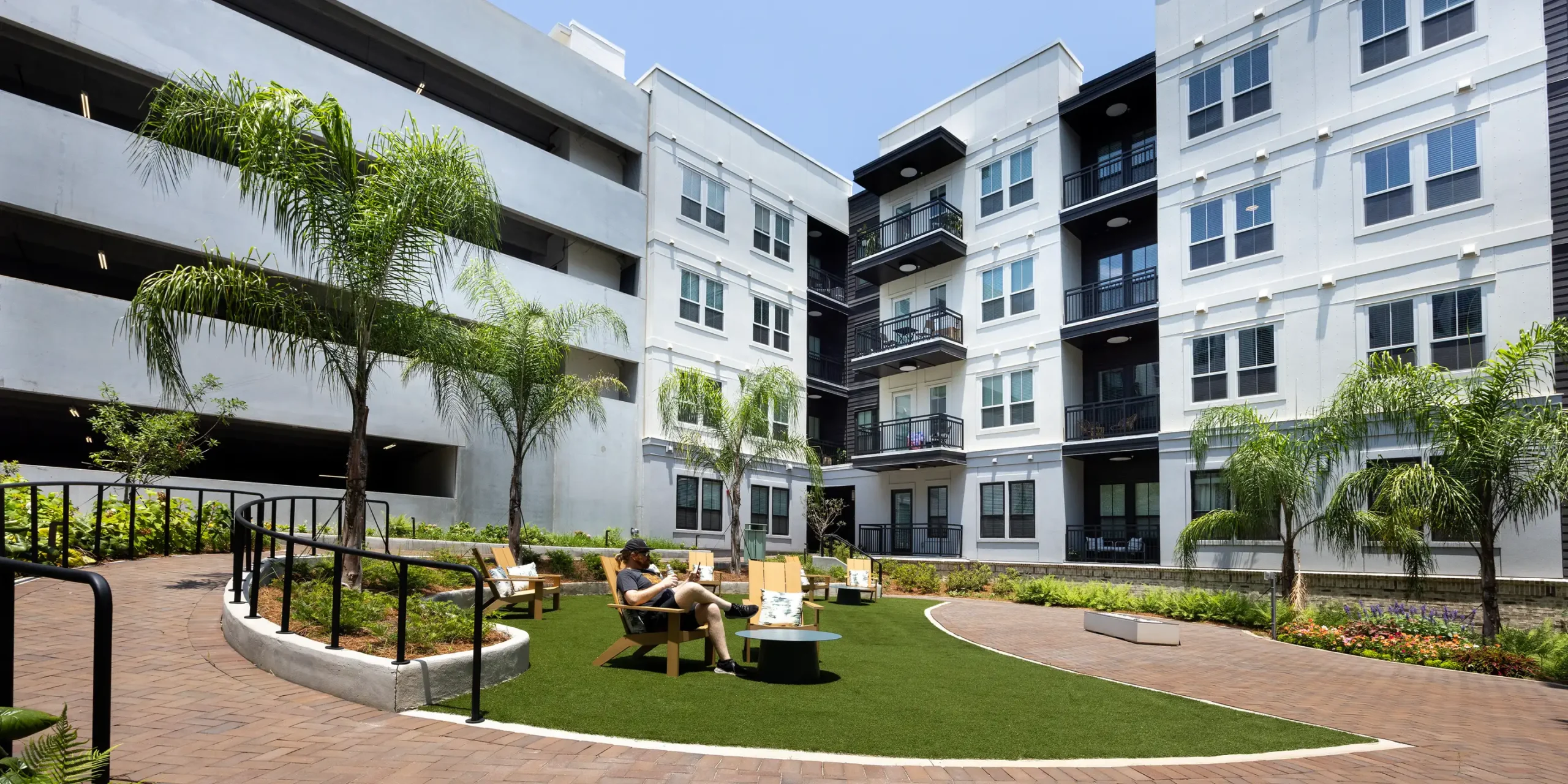 Landscaped courtyard at Pilot & Park with seating and community amenities.