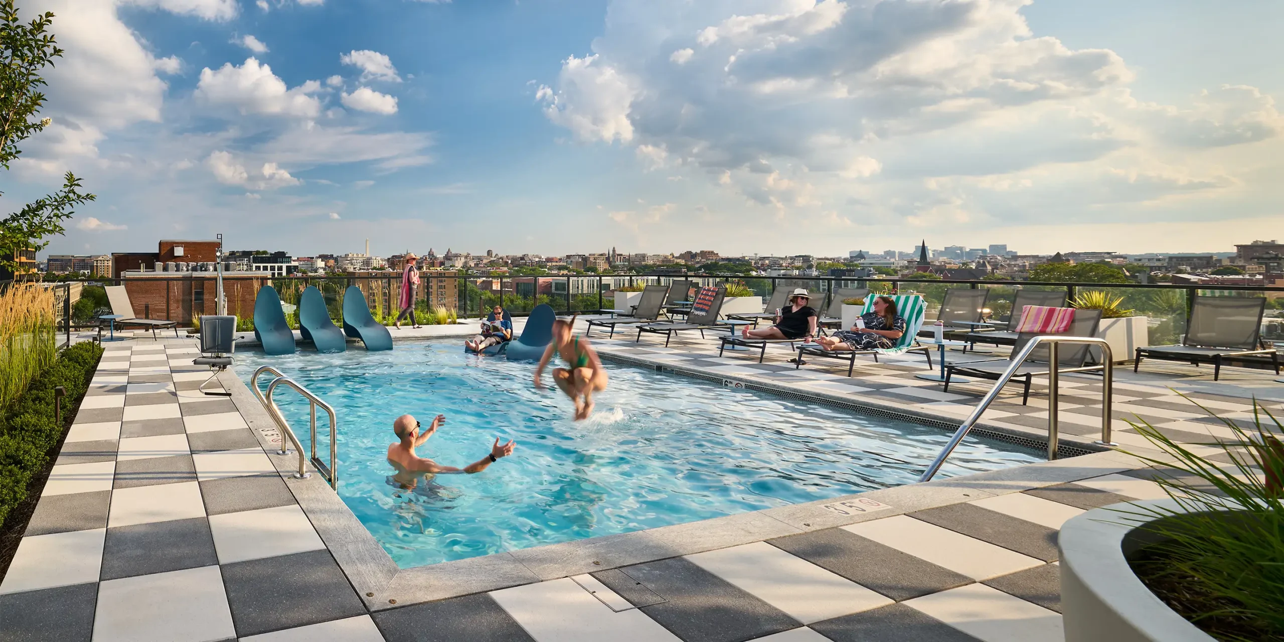 Rooftop pool and lounge deck at The Langston on Seventh with views of downtown Washington DC.