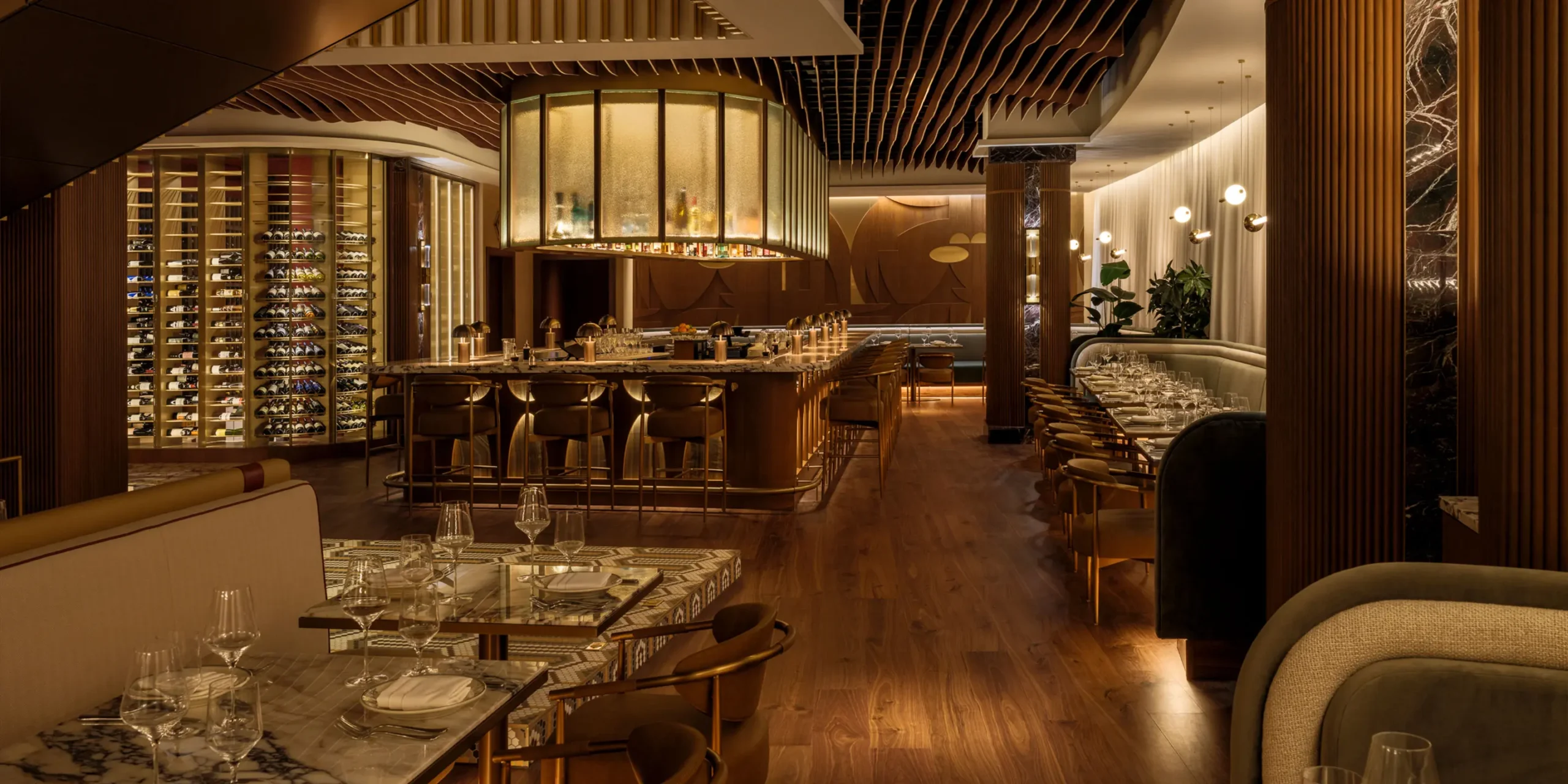 Sweeping 20-seat bar with football-inspired millwork and live music stage.