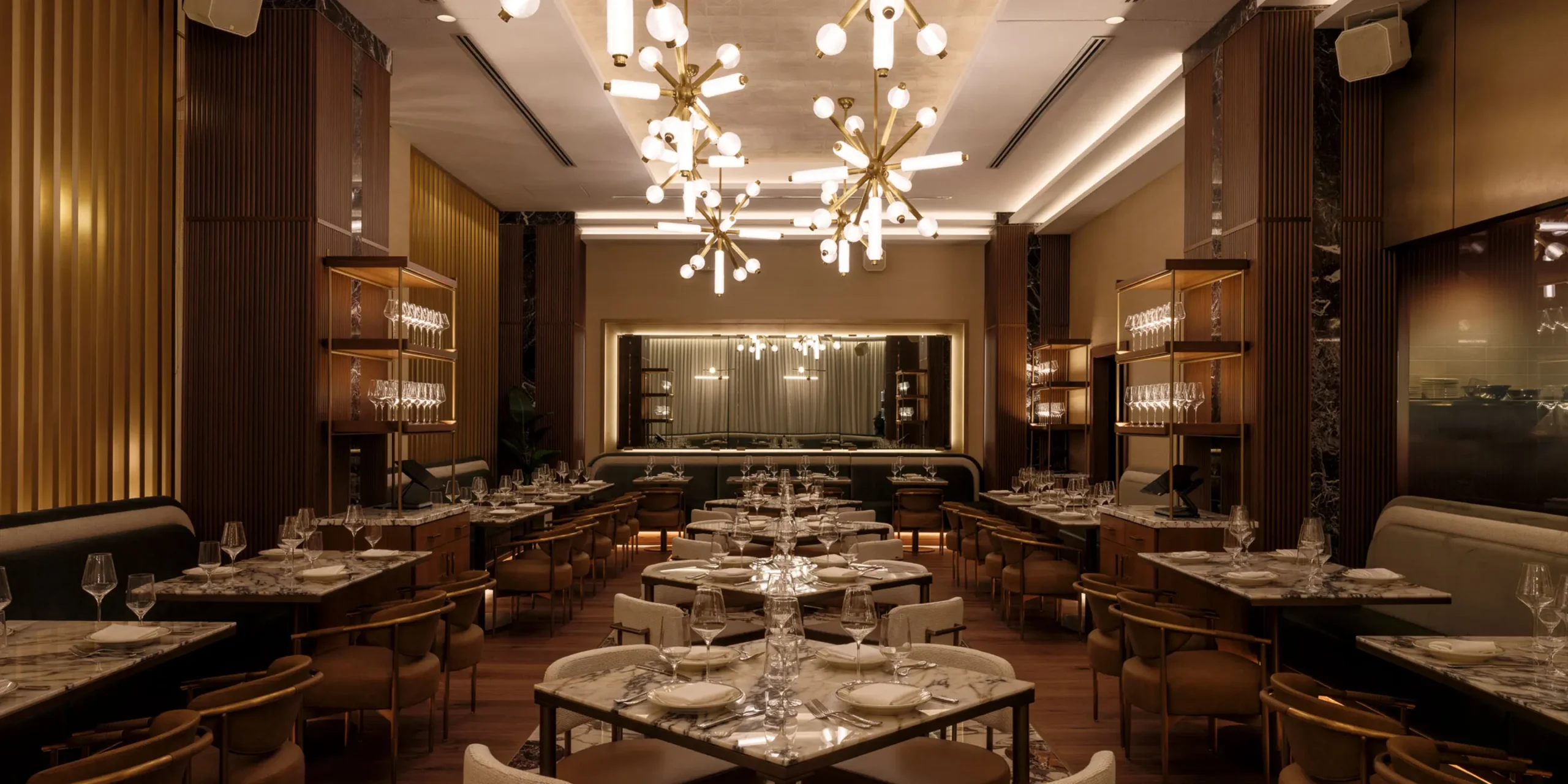 Main dining room with expo kitchen at 1587 Prime Kansas City steakhouse.