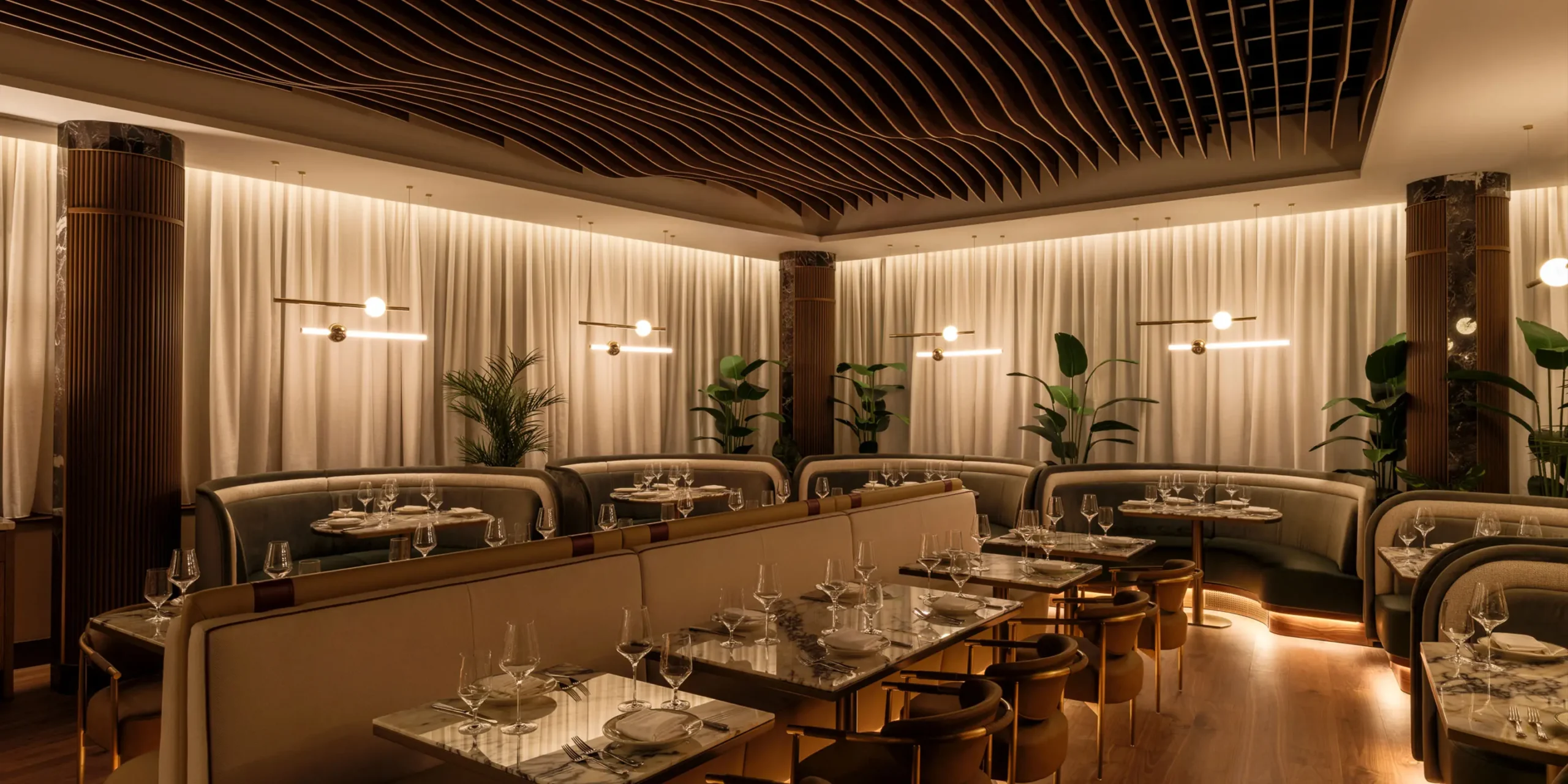 Main floor dining area with mood lighting and central bar at 1587 Prime Kansas City steakhouse.