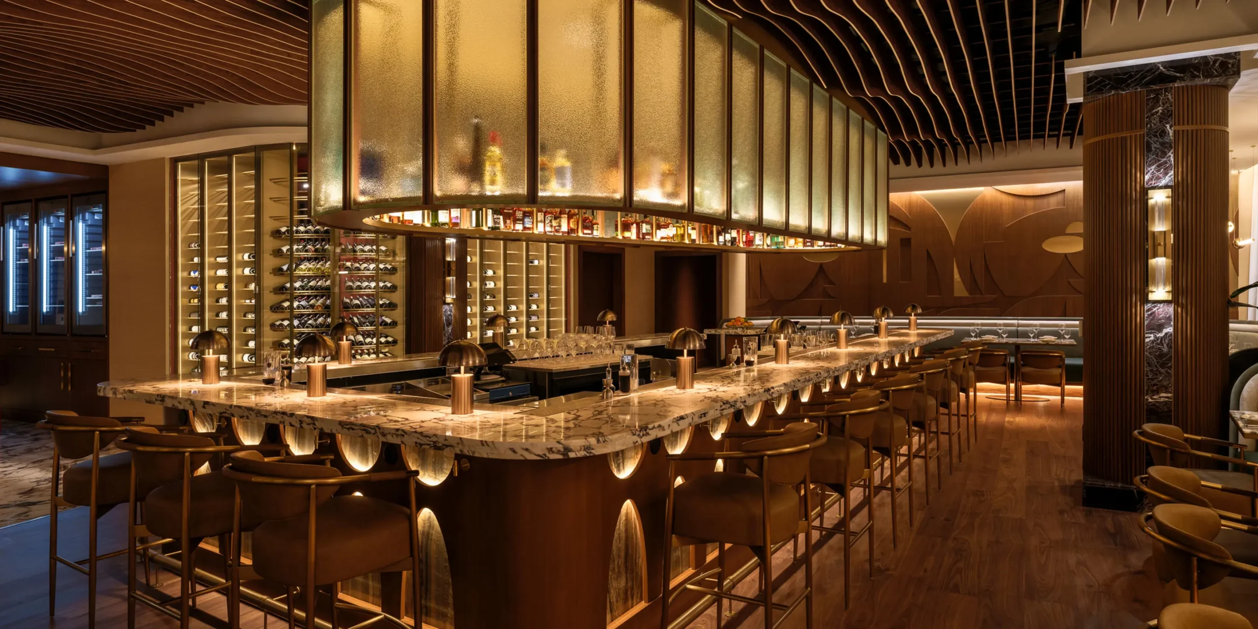 Sweeping 20-seat bar with football-inspired millwork and live music stage.