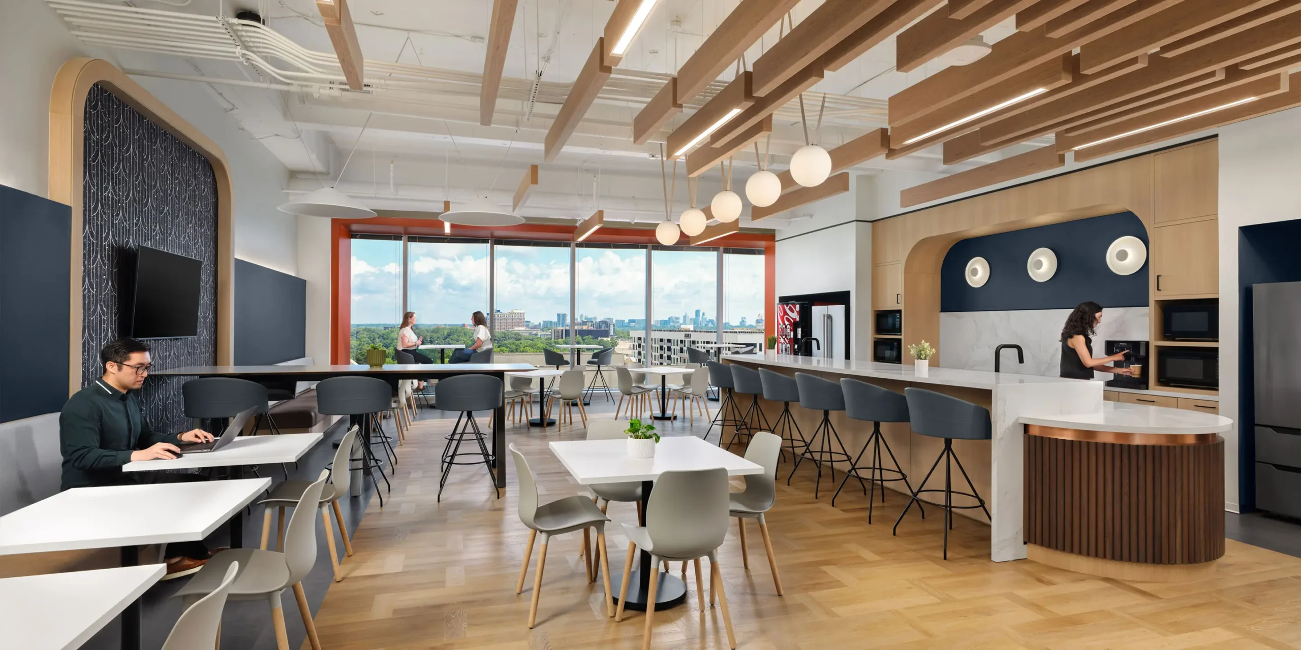 Collaboration zone with coffee bar and flexible seating designed for Piedmont System Support Center