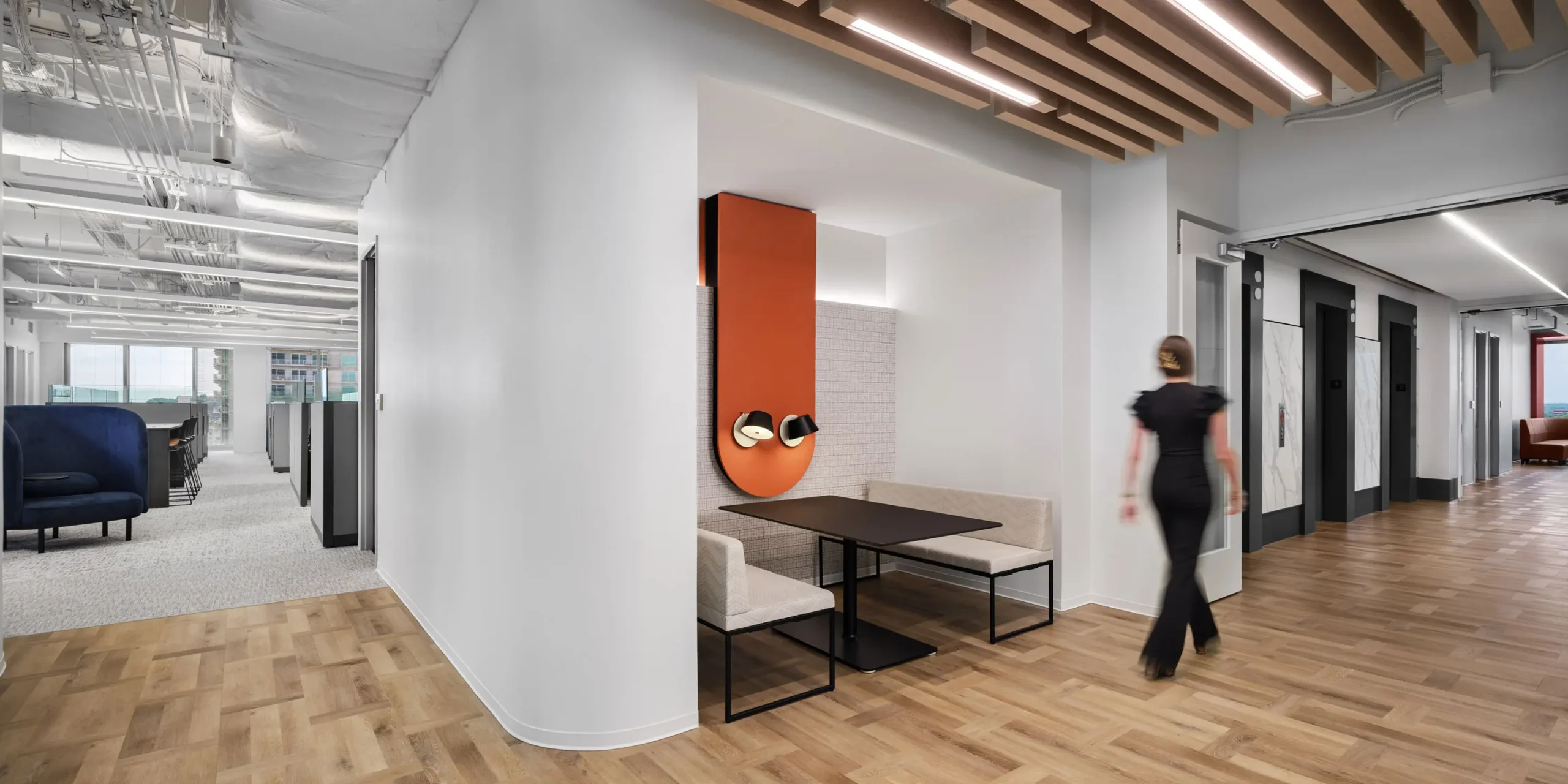 Modern corporate office lobby with natural finishes and seating, designed for Piedmont Healthcare by Cooper Carry