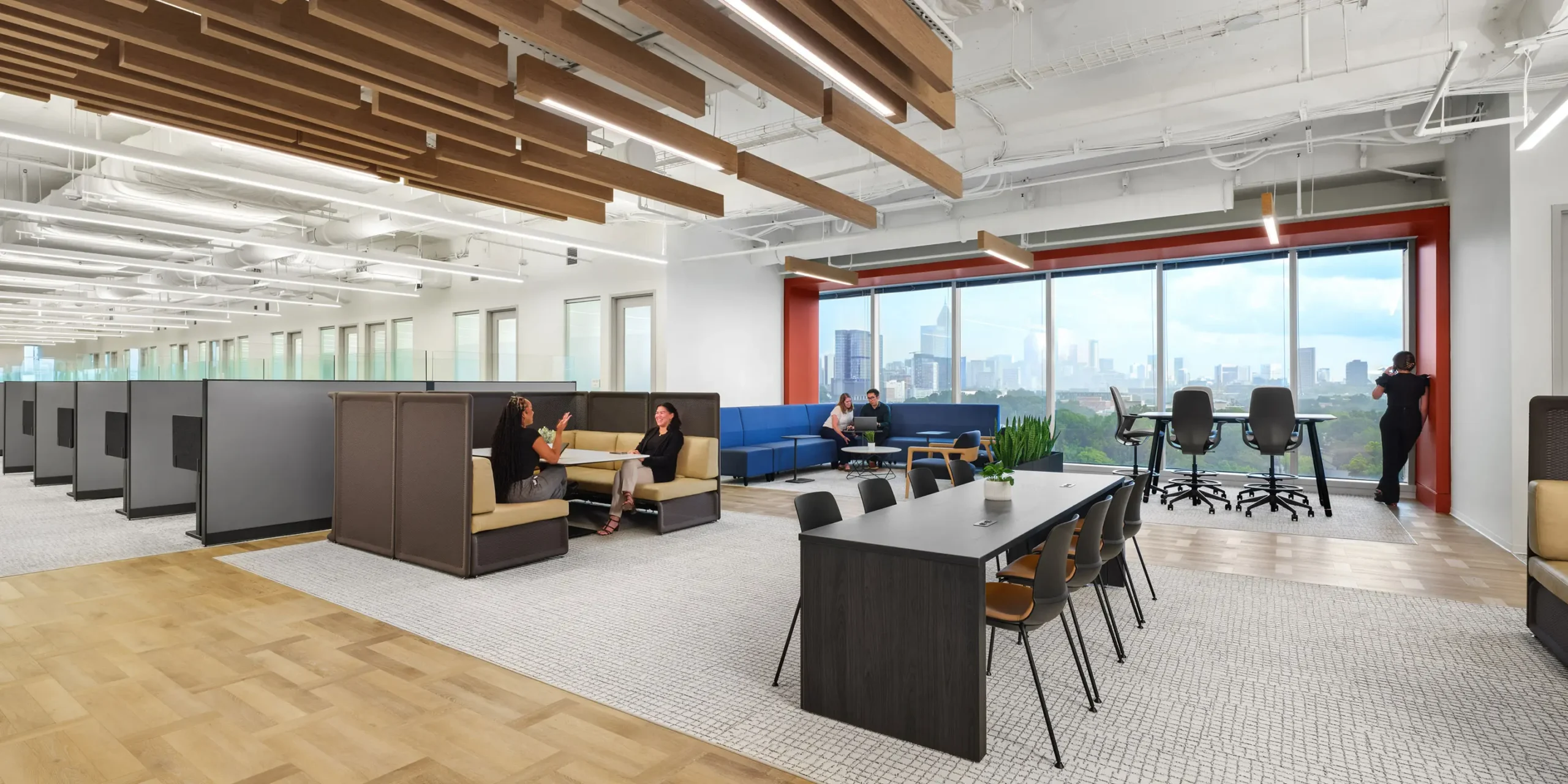 Efficient open office workspace designed with muted finishes and natural light for Piedmont Healthcare