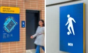Wall-mounted Stadium Information sign with map and key beside women’s restroom door featuring ADA-compliant signage; paired with a detail of the men’s restroom ADA sign showing a soccer-themed pictogram.