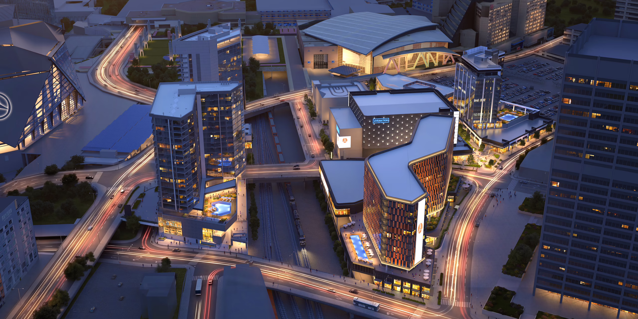 Aerial night rendering of Centennial Yards mixed-use district in downtown Atlanta, showing residential towers, rail corridor, and street-level activity